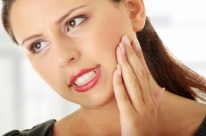 Grinding teeth can cause aching in the jaw and head. 